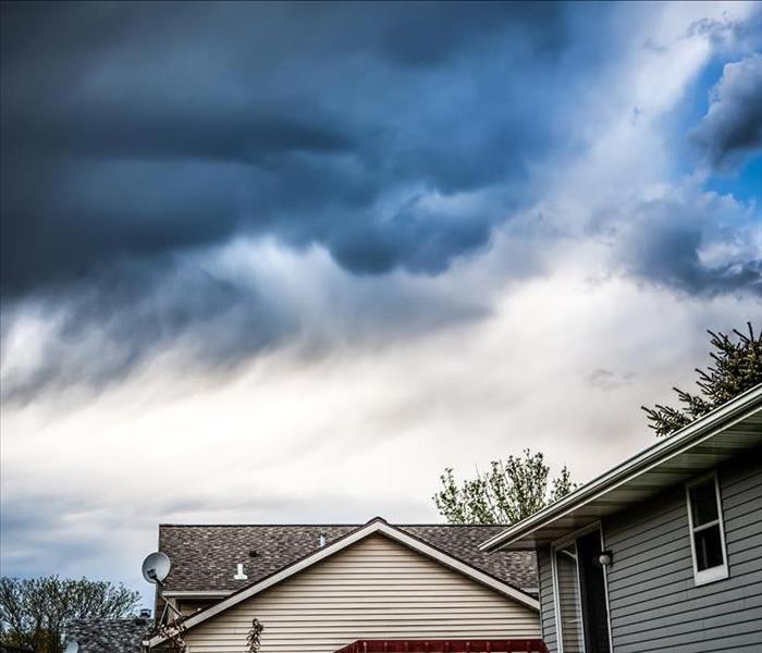 Dark storm clouds above a home.